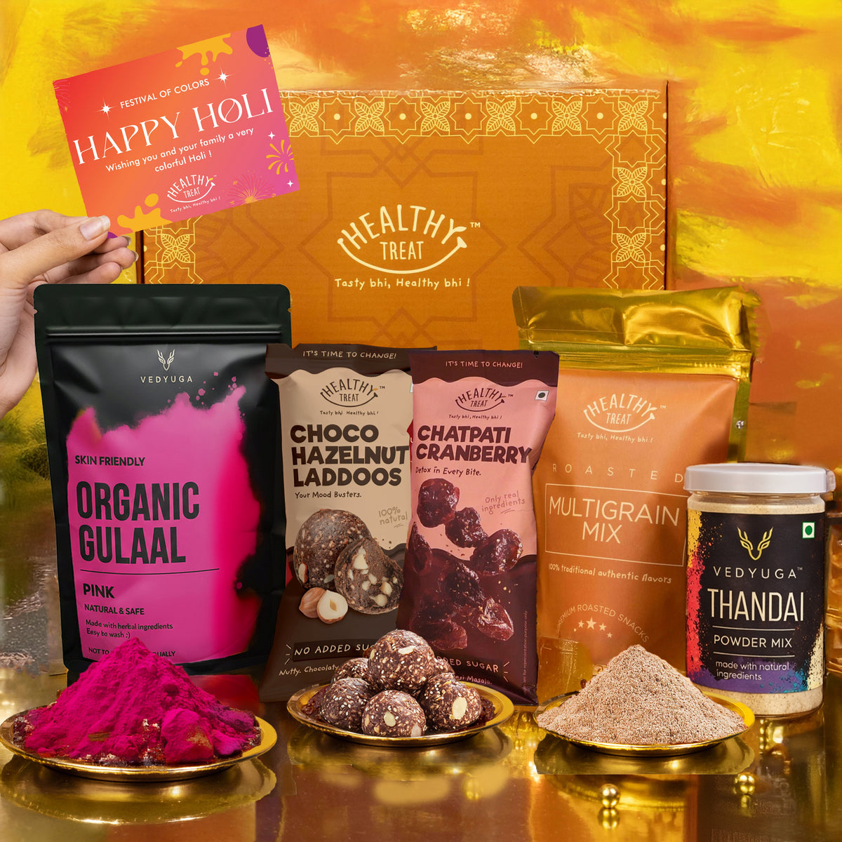 Healthy Treat Eternal Holi Gift Hamper | Roasted Healthy Snacks, Thandai Mix, Hazelnut Laddoo, Herbal Gulal & Holi Greeting Card
